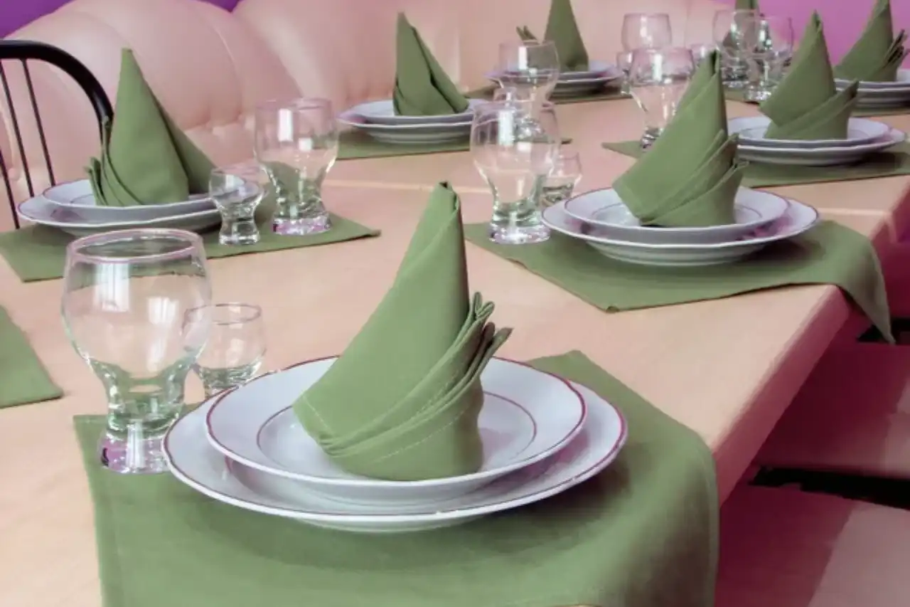 A table set with plates and napkins on it